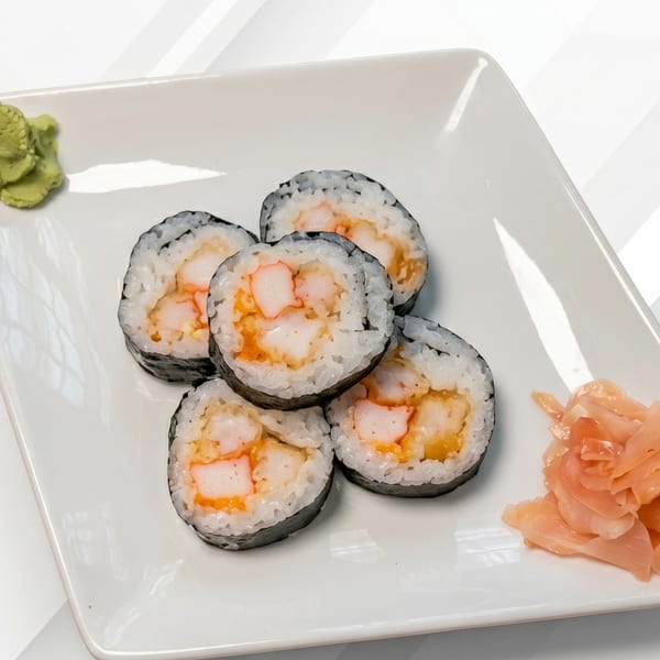 Five sushi rolls with shrimp and crab, served with wasabi and pickled ginger on a white plate.